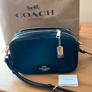 COACH Crossbody. New, took tag off but never wore it. 9”x7”x3.5”.